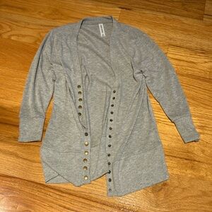 This is a quarter length cardigan. Great condition.